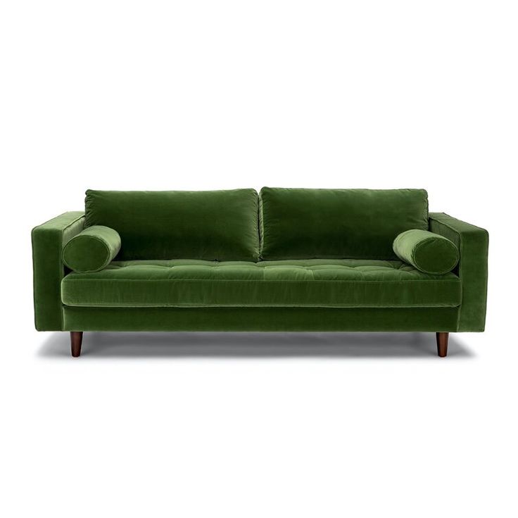 a green couch with two pillows on it's back and one arm facing the camera