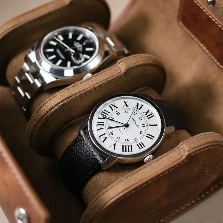 Perfect travel accessory or storage case for a watch enthusiast. Our sturdy and elegant leather watch box is the ultimate luxury solution for watch storage and protection, whether you're at home or on the go. Crafted from premium full-grain calfskin, this watch box is designed and tested to prevent damage to your watch while traveling. The inner lining is made from soft microfiber to protect your watch from scratches, while the snap cushions keep your watch in place and are simple to attach to t Luxury Watch Accessories With Case Included, Timeless Watch Accessories With Subdials For Everyday Use, Classic Leather Watches With Round Case, Classic Watches With Leather Strap And Round Case, Classic Business Watch With Round Case, Classic Leather Watches, Classic Round Case Business Watch, Timeless Business Watches With Round Case, Classic Leather Watch For Travel