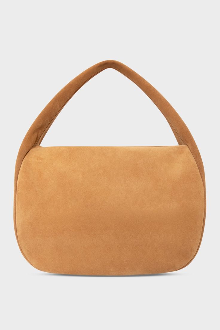 A large suede shoulder bag in the color tan. The handbag has a hobo inspired design. Modern Suede Hobo Bag With Double Handle, Modern Double Handle Suede Hobo Bag, Modern Suede Tote Hobo Bag, Modern Suede Shoulder Bag For On-the-go, Modern Rectangular Suede Hobo Bag, Modern Suede Shoulder Bag With Handle Drop, Modern Suede Bag With Zipper Closure, Luxury Designer Bags, Designer Shoulder Bag