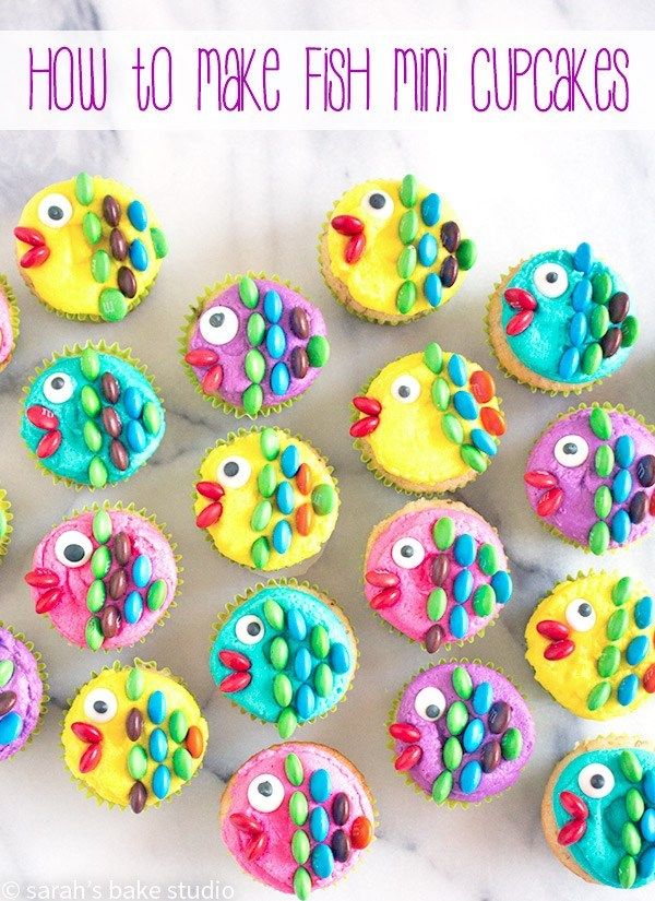 cupcakes with colorful frosting and fish decorations