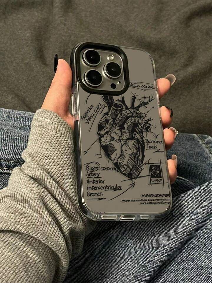 someone is holding up their phone case that has a drawing of a heart on it