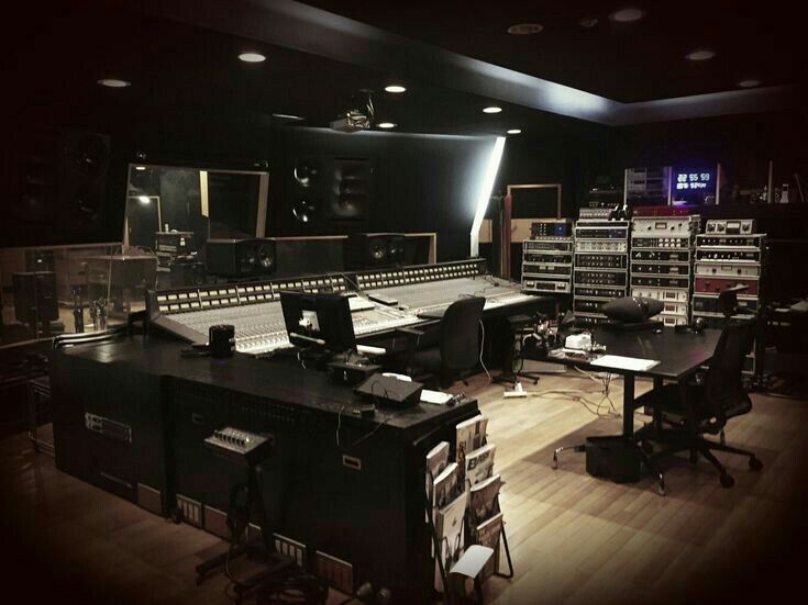 an empty recording studio with lots of equipment