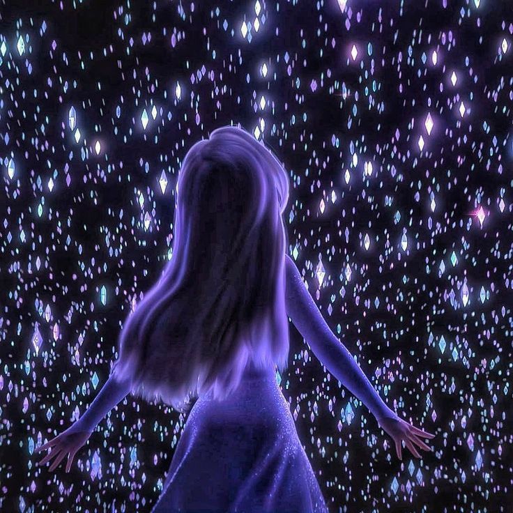 a woman standing in front of a sky full of stars