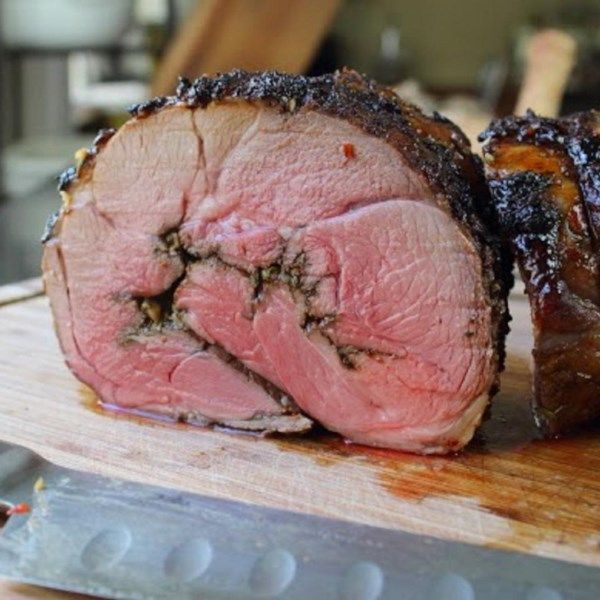 the meat is sliced up and ready to be served on the cutting board for consumption