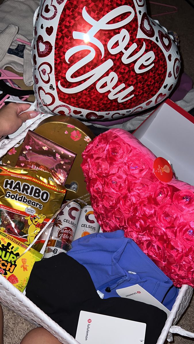 a basket filled with candy and other items