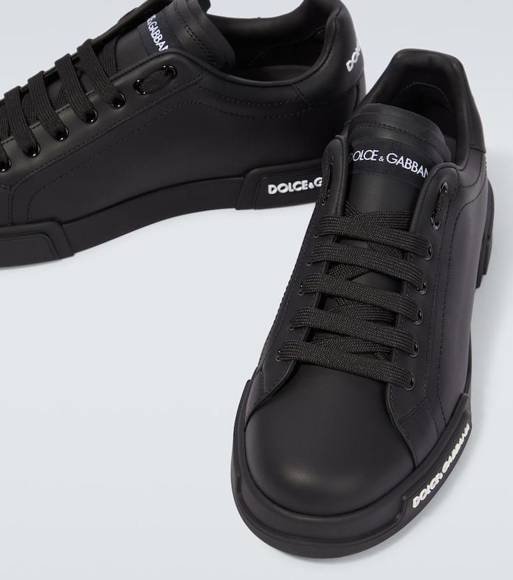 Find DOLCE & GABBANA Logo Leather Sneakers on Editorialist. Lining: leather. Sole: leather insole, rubber sole. Toe shape: round toe. Upper: leather. Closure: lace-up. Designer color name: Black/Black. Comes with a box. Made in Italy. Comes with dust bag. Black Sneakers With Vulcanized Sole In Calf Leather, Black Calf Leather Sneakers With Vulcanized Sole, Sneakers With Leather Sole And Round Toe, Leather Shoes With Leather Sole For Streetwear, Leather Streetwear Shoes With Leather Sole, Leather Sole Sneakers With Round Toe And Medium Fit, Designer Sneakers With Stitched Sole And Round Toe, Designer Leather Sneakers With Round Toe, Black Low-top Calf Leather Shoes