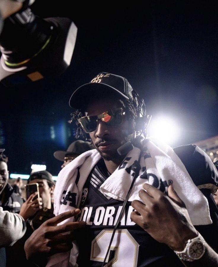 a football player is standing in the crowd