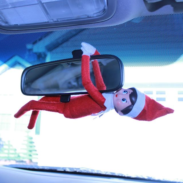 the elf is hanging upside down in the car