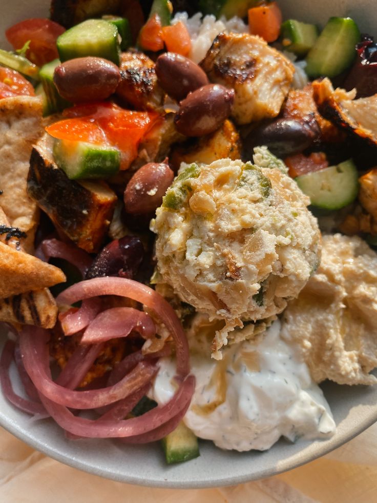 a white bowl filled with different types of food