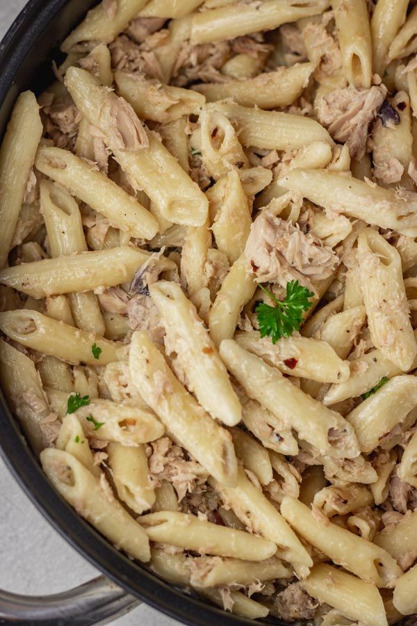 pasta with meat and parsley in a pan