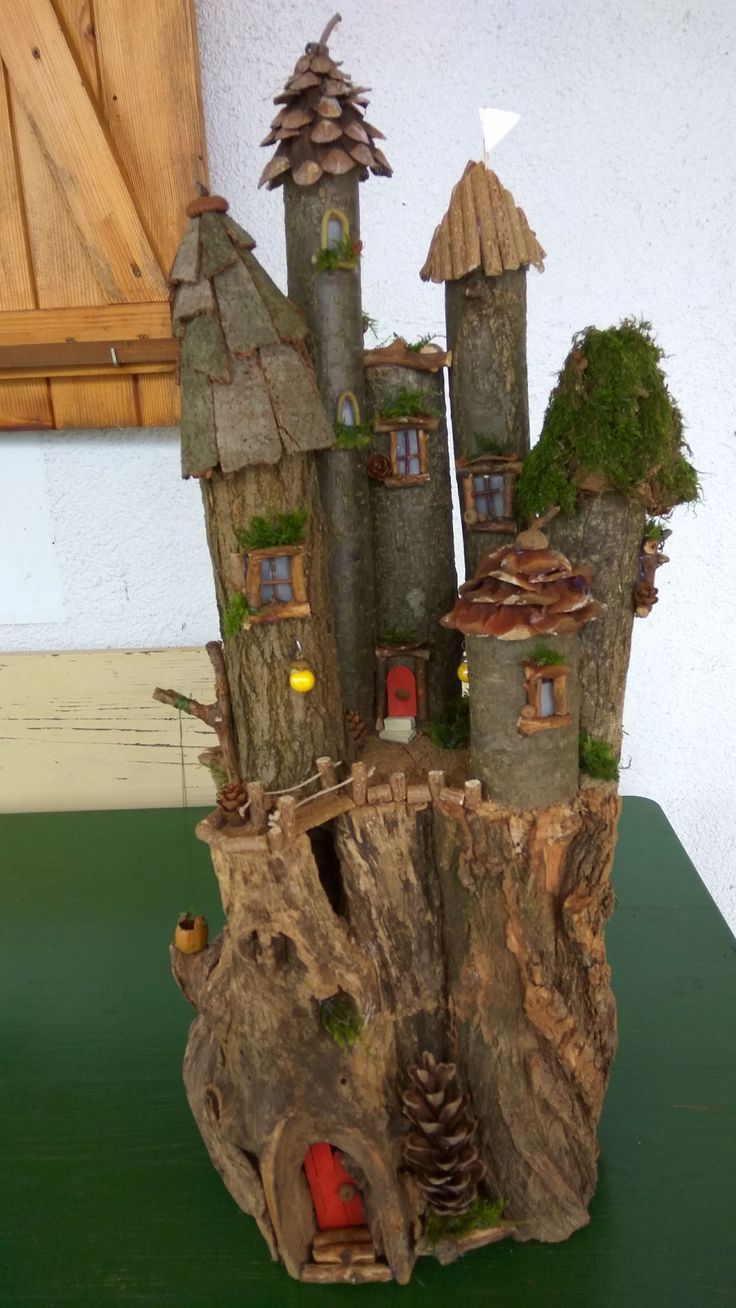 a tree stump with some houses on it