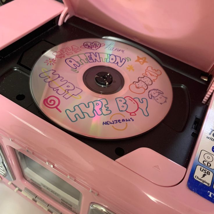 a pink cd case with hello kitty on it