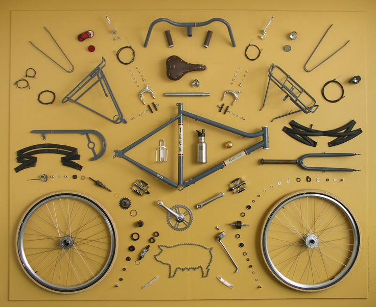 an assortment of bicycle parts displayed on a yellow background