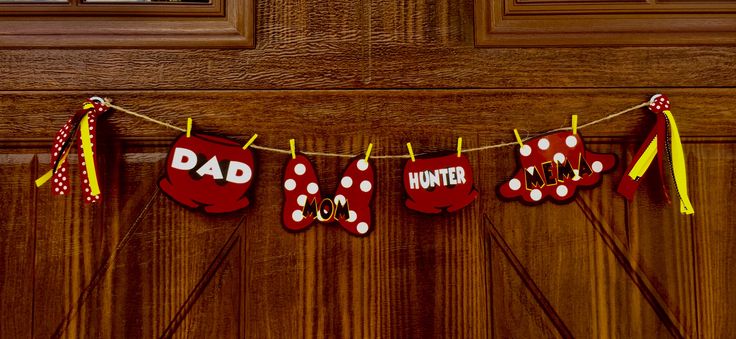 a red and white banner that says, dad hangs on a door with polka dots