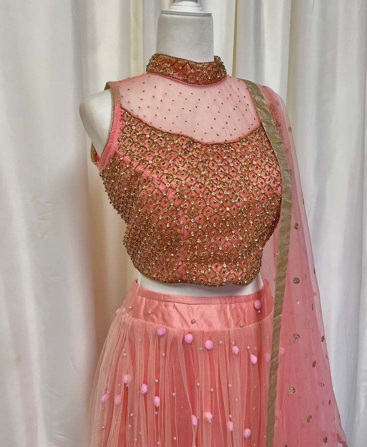 *3 Piece set - gold embellished halter blouse, net skirt, matching net shawl *Readymade: Size bust 36, 38 inches *Please message us for size customization options! *Our store is located in Los Angeles and in-store pick up is welcome! Fitted Anarkali Net Choli, Festive Fitted Lehenga In Net Material, Festive Fitted Lehenga In Net, Diwali Embellished Net Lehenga, Embellished Net Lehenga For Diwali, Embellished Net Saree Dress, Traditional Net Blouse Piece For Reception, Embellished Semi-stitched Net Choli, Embellished Net Dress With Traditional Drape