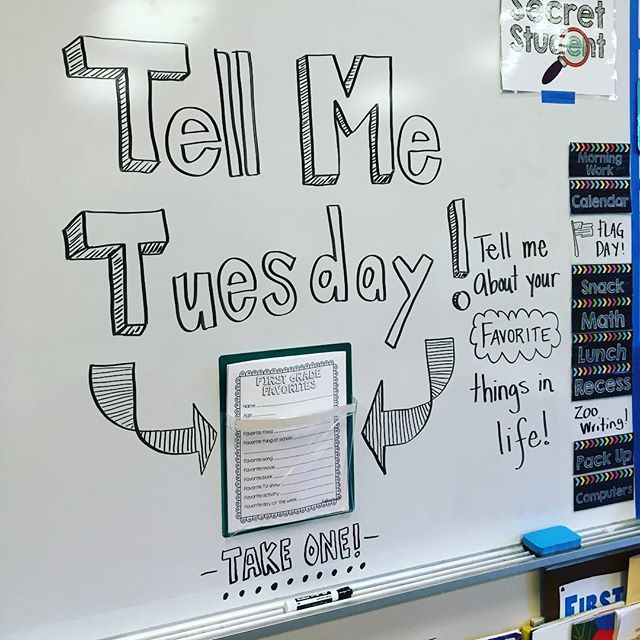 a whiteboard with writing on it that says tell me tuesday and there are books