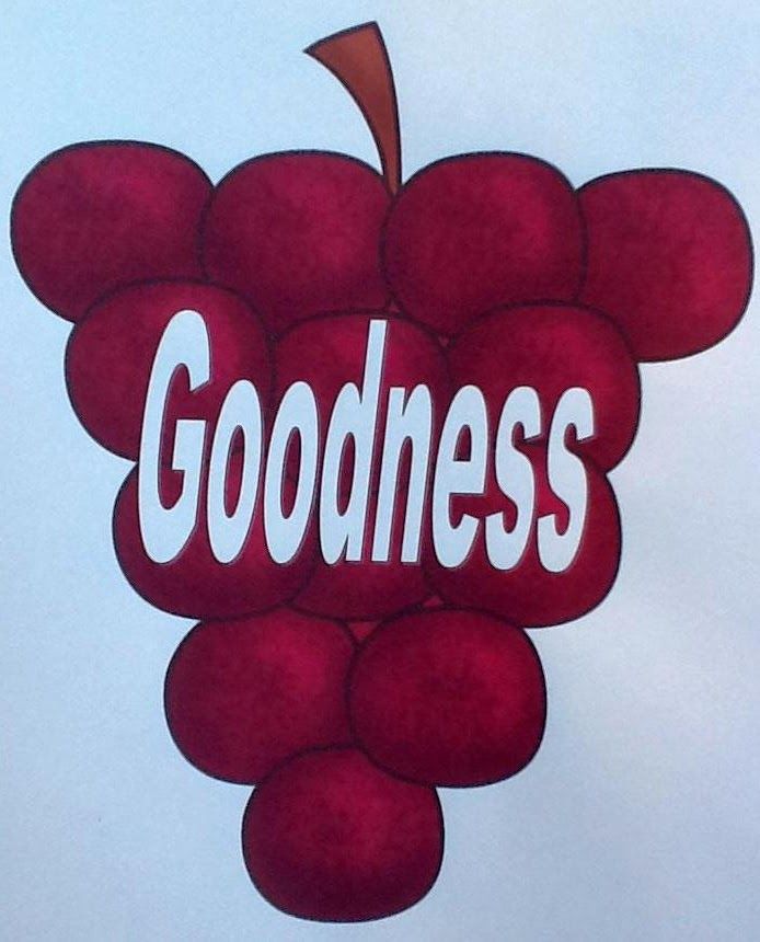 a sign that says goodness on it with grapes in the center and an arrow sticking out of it