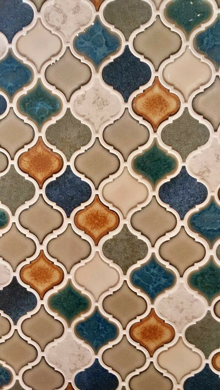 a close up view of a colorful tile pattern