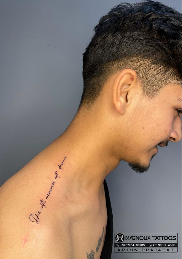 a man with a tattoo on his neck