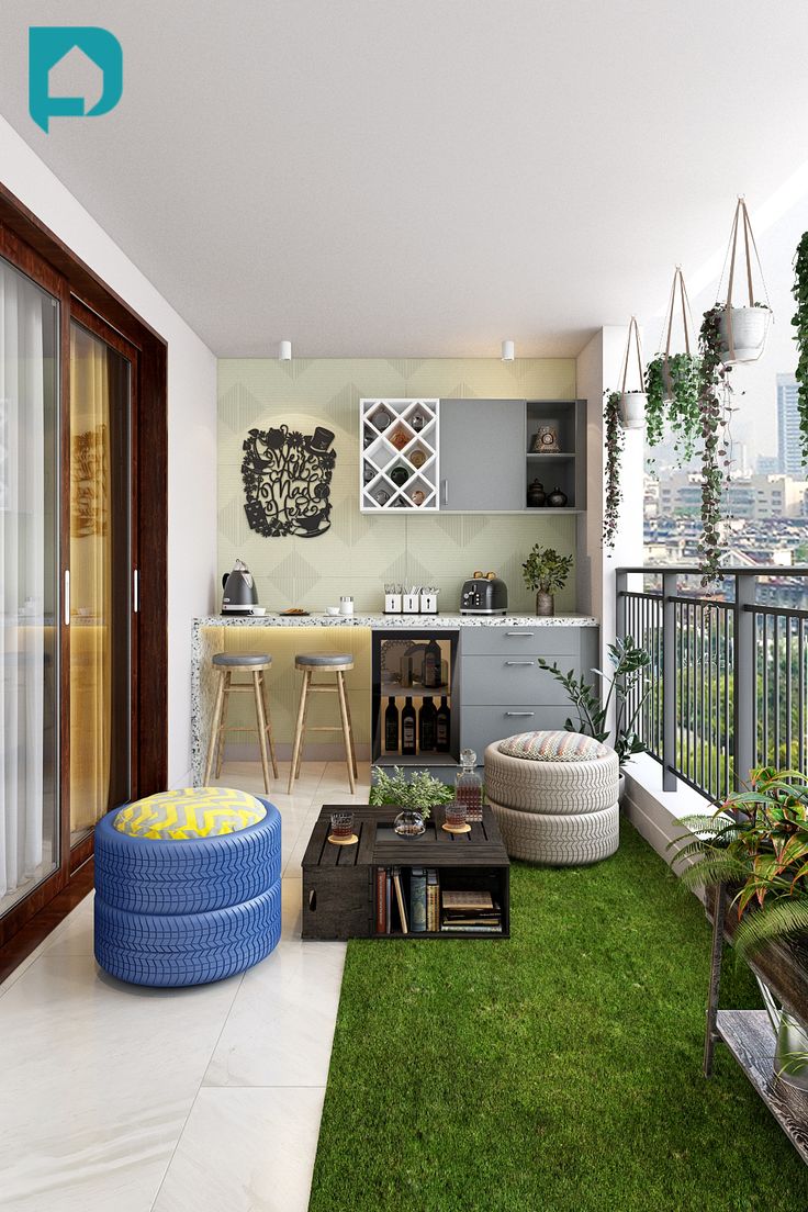 an outdoor living area with green grass and potted plants on the balcony, next to a bar