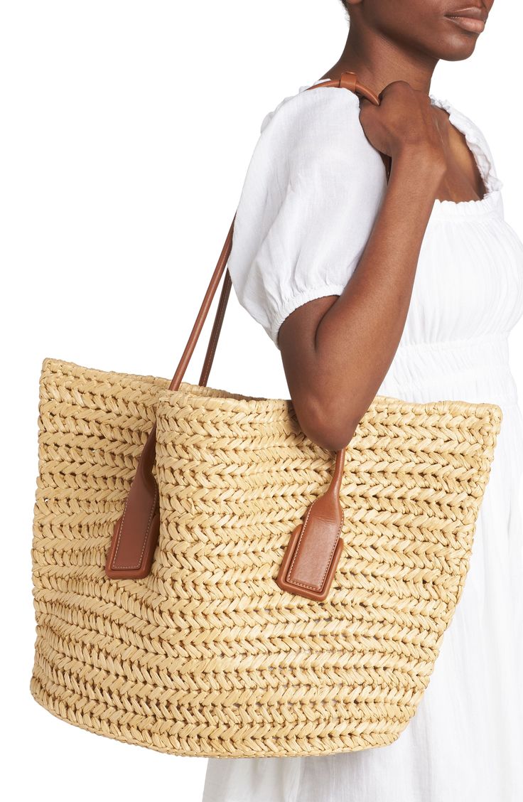 Crocheted raffia brings warm-weather charm to this roomy tote named for the elegantly arched over-the-shoulder handles. Open top Top carry handles Removable zip pouch Flat base for stability Raffia with leather trim Made in Italy Designer Handbags Luxury Straw Tote Bag With Rolled Handles, Luxury Natural Straw Bag With Braided Handles, Luxury Rectangular Straw Bag With Rolled Handles, Beige Rectangular Straw Bag With Intrecciato Weave, Luxury Natural Crochet Bag With Intrecciato Weave, Luxury Beach Bag With Leather Handles, Luxury Natural Woven Crochet Bag, Straw Market Bag With Double Handle, Luxury Rectangular Beach Bag For Shopping