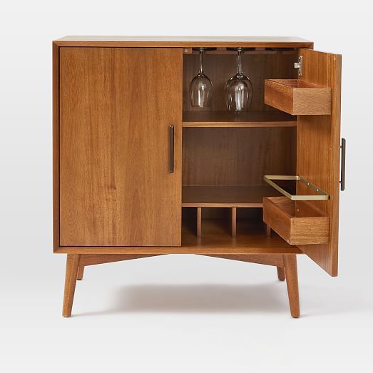 a wooden cabinet with two wine glasses in it