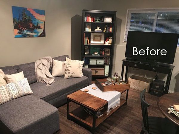 a living room filled with furniture and a flat screen tv on top of a wooden table