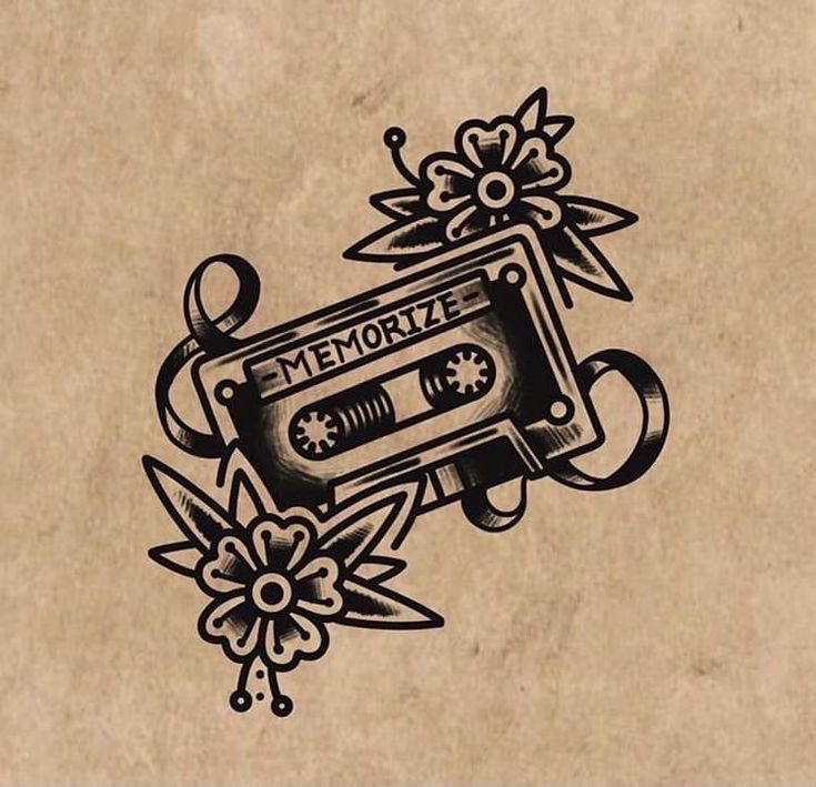 an old school tattoo design with a tape recorder and flowers on the bottom half of it