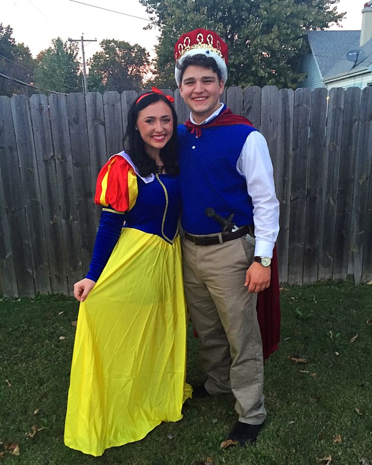 a man and woman dressed up as snow white and prince charmingly pose for the camera