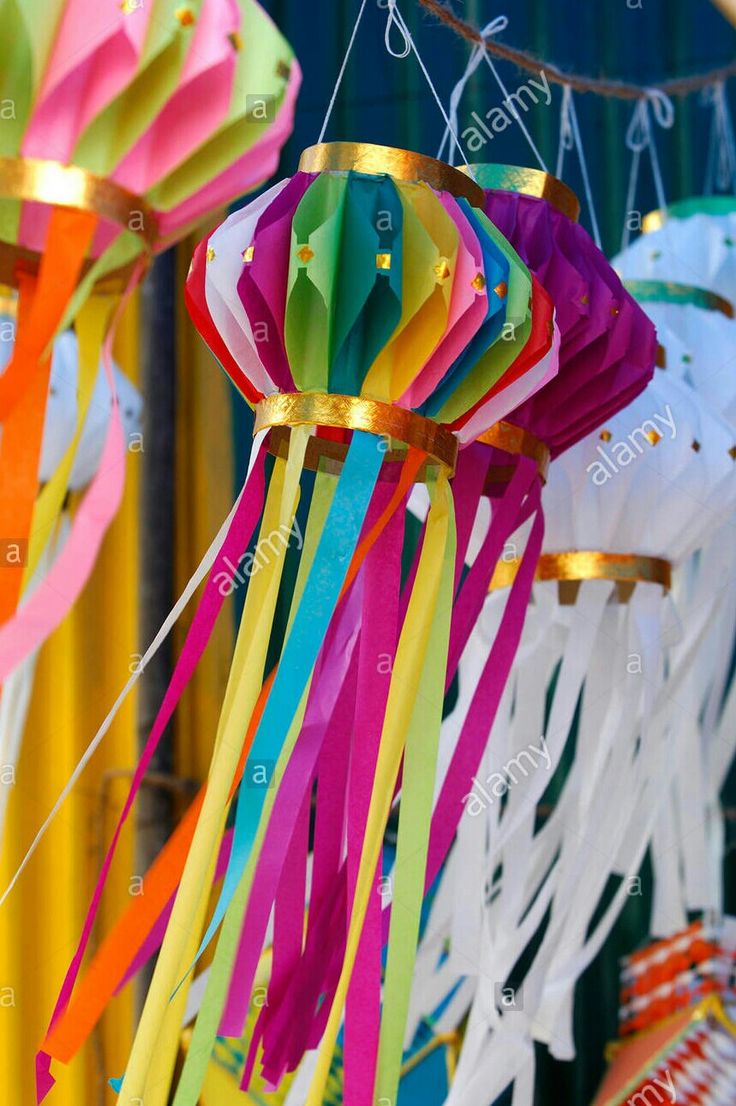 colorful streamers hanging from the ceiling at a carnival - stock image