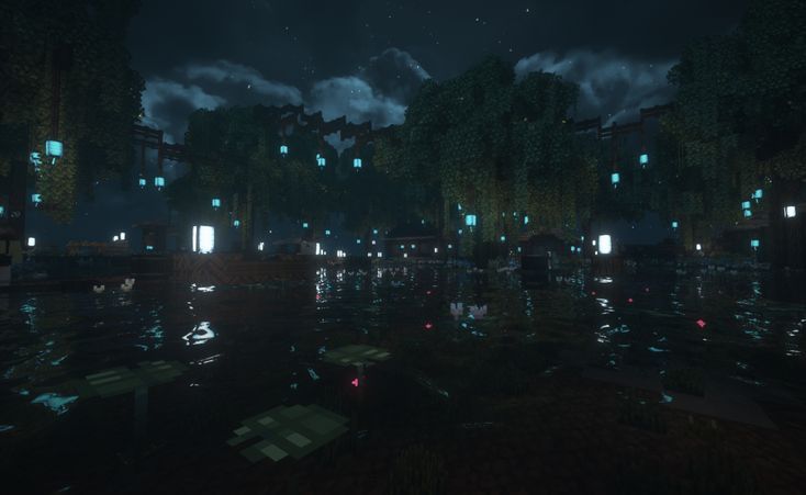 an image of a city at night in the water with buildings and trees around it