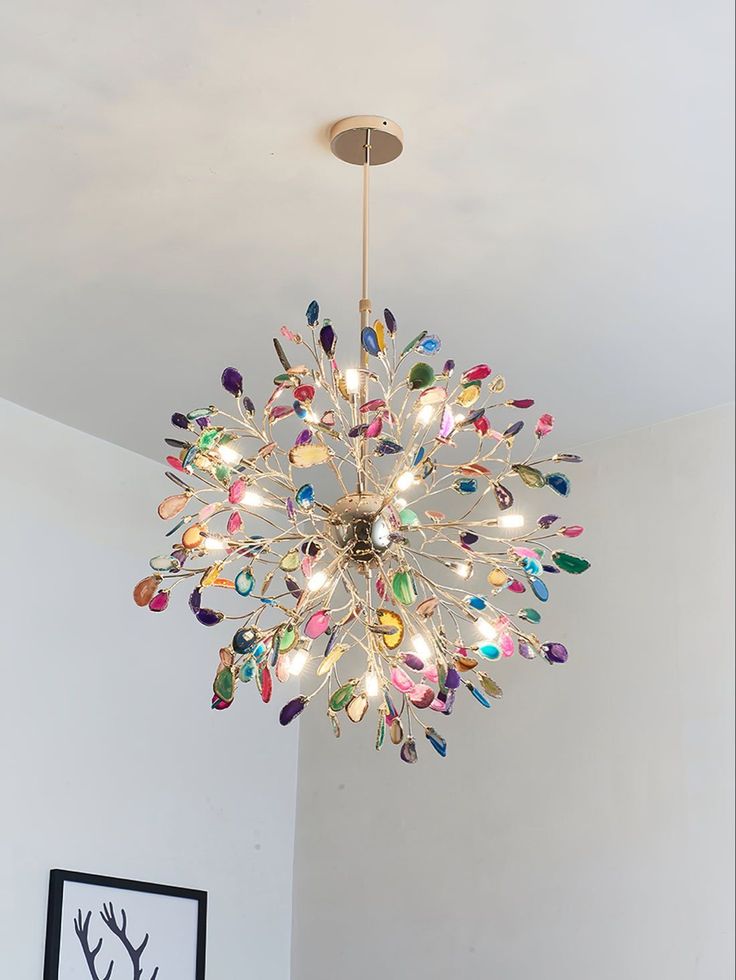 a chandelier hanging from the ceiling in a room