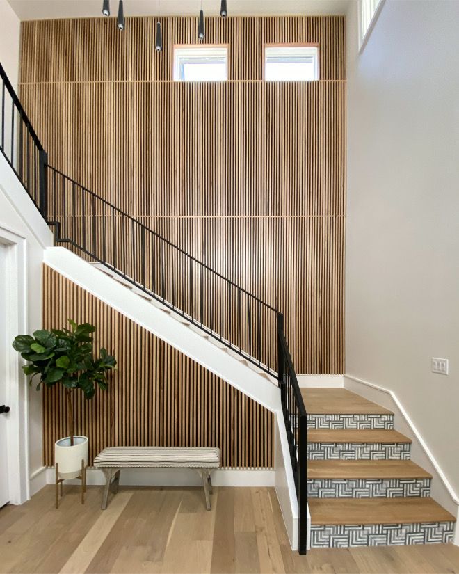 the stairs in this house are lined with wood slats