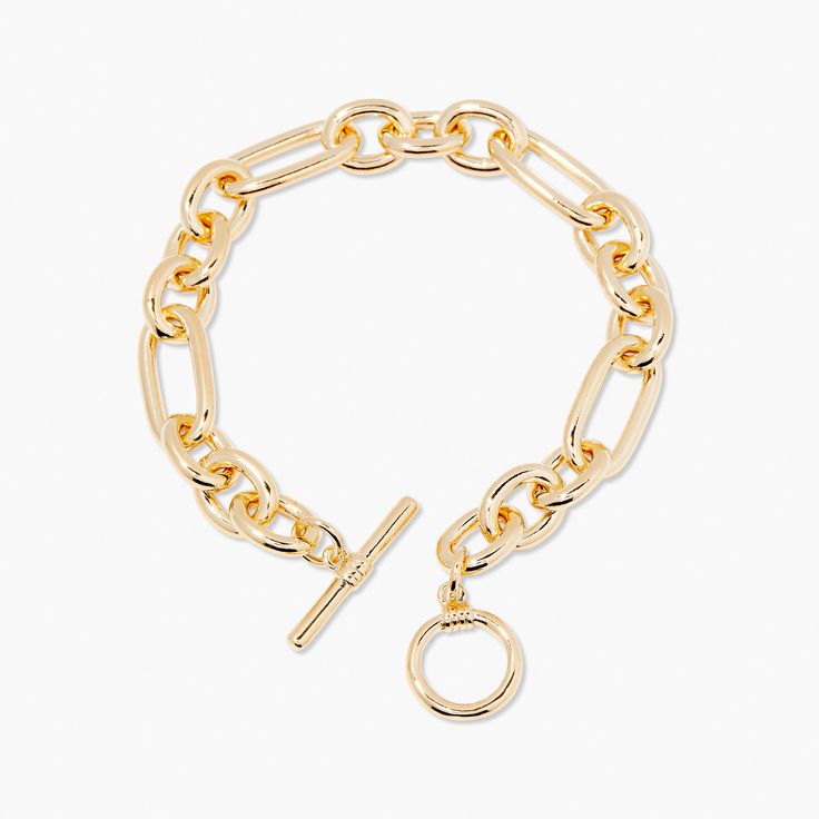 Feel beautiful wearing our Monroe Toggle Bracelet, crafted from a luxe link chain with an easy toggle closure. Dare to stand out wearing the perfect balance of contemporary and classic style in gold. Make the Monroe Toggle Bracelet your signature accessory and be surprised by the endless compliments you receive. Dare to shine with Monroe. Available in 14k gold plated brass 7" link chain 1/2" toggle closure SKU: BYB1171 Chic Jewelry With Toggle Clasp And Link Shape, Chic Chain Link Bracelet With Lobster Clasp, Chic Gold-tone Link Chain Bracelet, Chic Gold-tone Bracelet With Rectangular Links, Chic Jewelry With Toggle Clasp And Chain Link, Chic Chain Link Jewelry With Toggle Clasp, Trendy Gold-tone Oval Link Chain Bracelet, Chic Gold-tone Oval Link Chain Bracelet, Chic Metal Chain Bracelet With Lobster Clasp