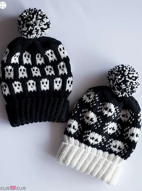 two black and white knitted hats sitting next to each other