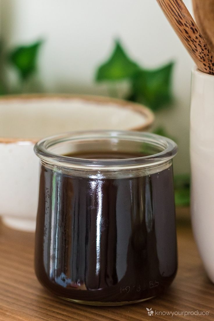 homemade teriya sauce in a glass jar on a wooden table with text overlay reading healthy vegan - plant based homemade teriya sauce