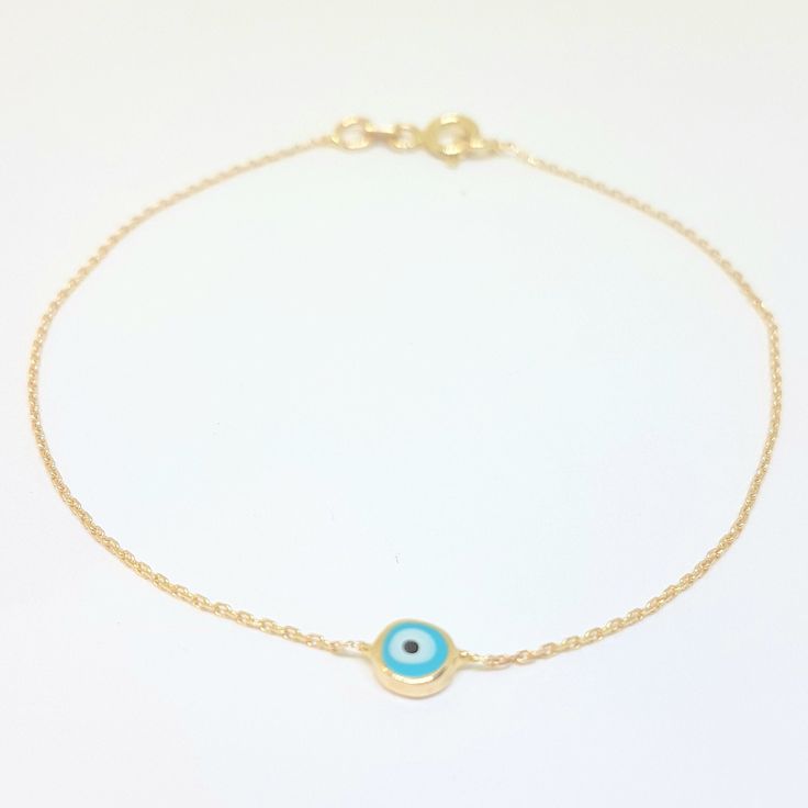 - Evil Eye Single Bracelet is made with high quality 14K real solid yellow gold. - Evil Eye Single Bracelet for women decorateded with two different color enamel options, navy blue and turquoise. Its length is 7 inches( We can shorten it, please contact with us). The diameter of the round evil eye is 6 mm. - This Evil Eye Single Bracelet is also available as a necklace. And there are trio evil eye models on our listings. - This cute, charm, dainty, delicate, elegant, trendy women jewelry 14K Rea Blue Round Gold Bracelet For Gift, Blue Bracelet With Adjustable Chain As Gift, Blue Bracelet With Adjustable Chain For Gift, Dainty Blue Bracelet With Adjustable Chain, Blue Hypoallergenic Round Bracelets, Hypoallergenic Blue Round Bracelets, Blue Hypoallergenic Bracelets, Dainty Blue Round Evil Eye Bracelet, Snowflake Bracelet