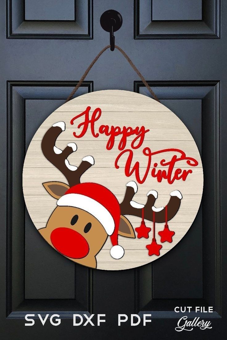 a christmas door hanger that says happy winter with reindeers and snowflakes on it