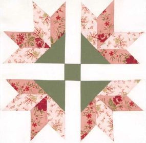 an image of a flowered star quilt pattern on white paper with pink and green accents