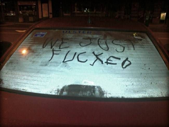 the back window of a car with writing on it