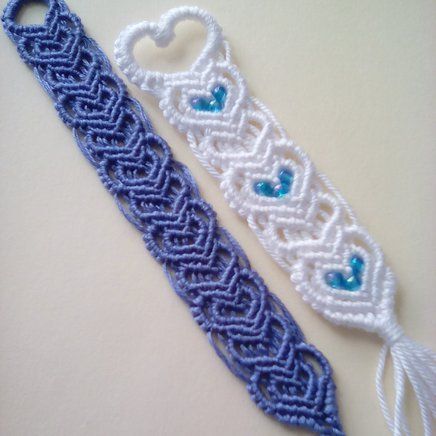 two blue and white crocheted items sitting next to each other