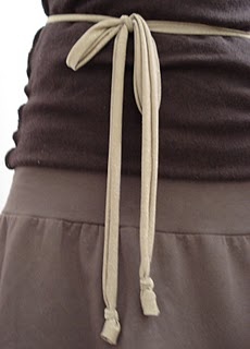 a woman's waist with a tie around it