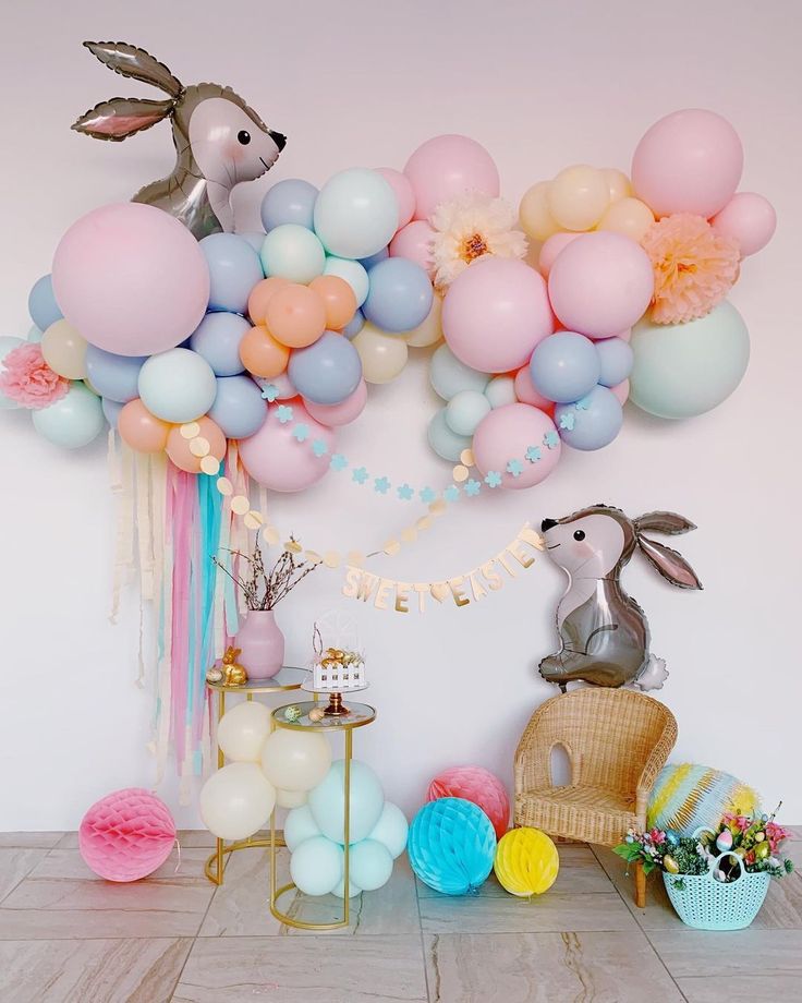 a room filled with balloons and stuffed animals