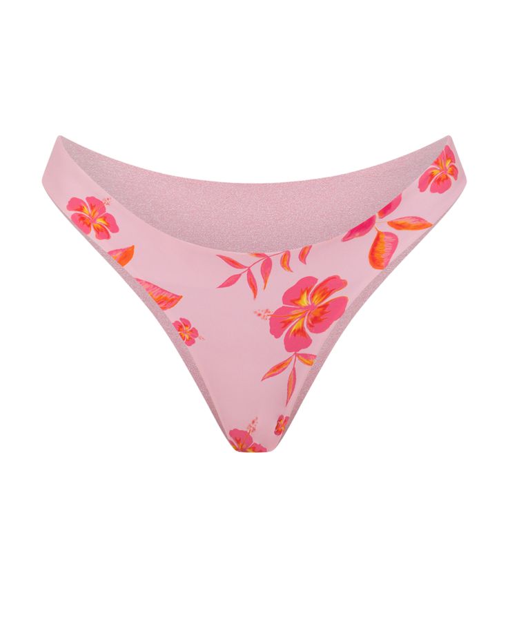 Our new everyday bottoms are designed to sit on or above the hip with a medium coverage back. Featured in our Flores print, an intricate hand-drawn bloom capturing summer in a beautiful layered pink colorway. With a quick flip, reveal a luxurious pink shimmer fabric. Stretch Tropical Bottoms With Floral Print, Tropical Stretch Bottoms With Floral Print, Tropical Stretch Floral Print Bottoms, Beach Stretch Bottoms With Floral Print, Spring Floral Print Swim Bottoms, Floral Print Spring Swim Bottoms, Stretch Floral Print Beach Bottoms, Pink Bottoms For Poolside Spring, Pink Tropical Print Poolside Bottoms