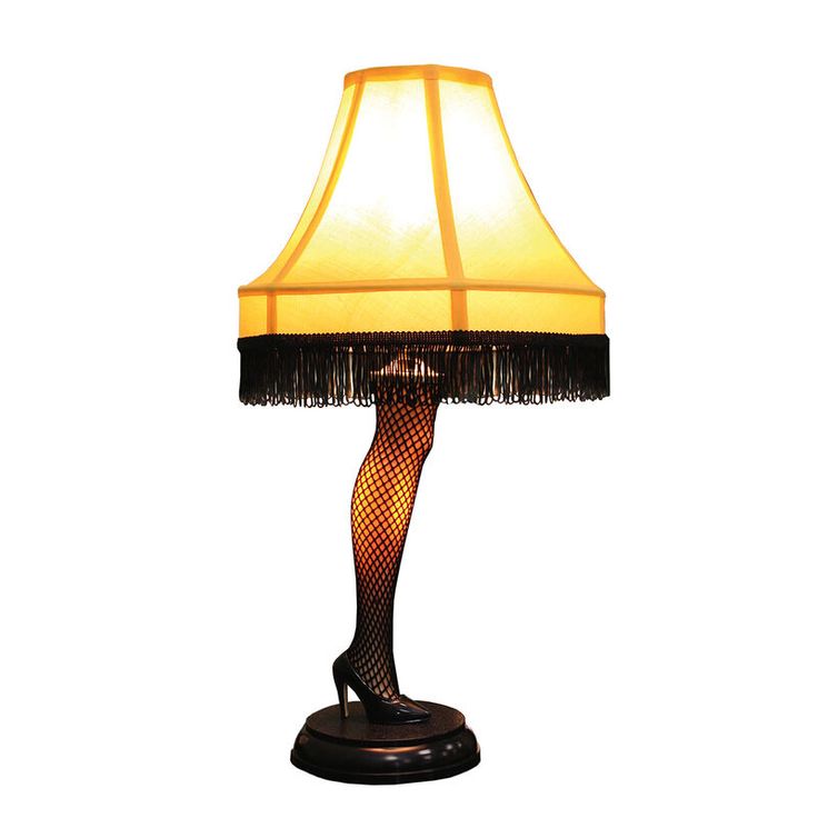 a lamp that is sitting on top of a wooden base with a black and yellow shade