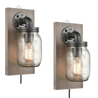 two mason jar wall sconces with one light on each side