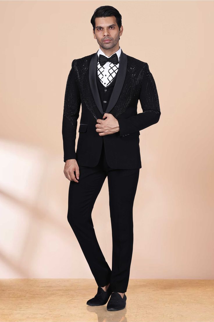 This luxurious tuxedo features stunning cutdana and black pearls, adding a touch of elegance and sophistication to any formal event. The intricate design and premium materials truly make it a one-of-a-kind piece, elevating your style and making a statement of refinement. Luxury Black Tuxedo For Black Tie Events, Luxury Black Blazer For Black Tie Events, Black Tailored Suits For Gala, Elegant Black Suit For Gala, Tailored Black Suit For Gala, Luxury Black Suits For Gala Events, Bespoke Black Tuxedo For Black Tie Events, Bespoke Black Tuxedo For Party, Black Evening Suits For Gala