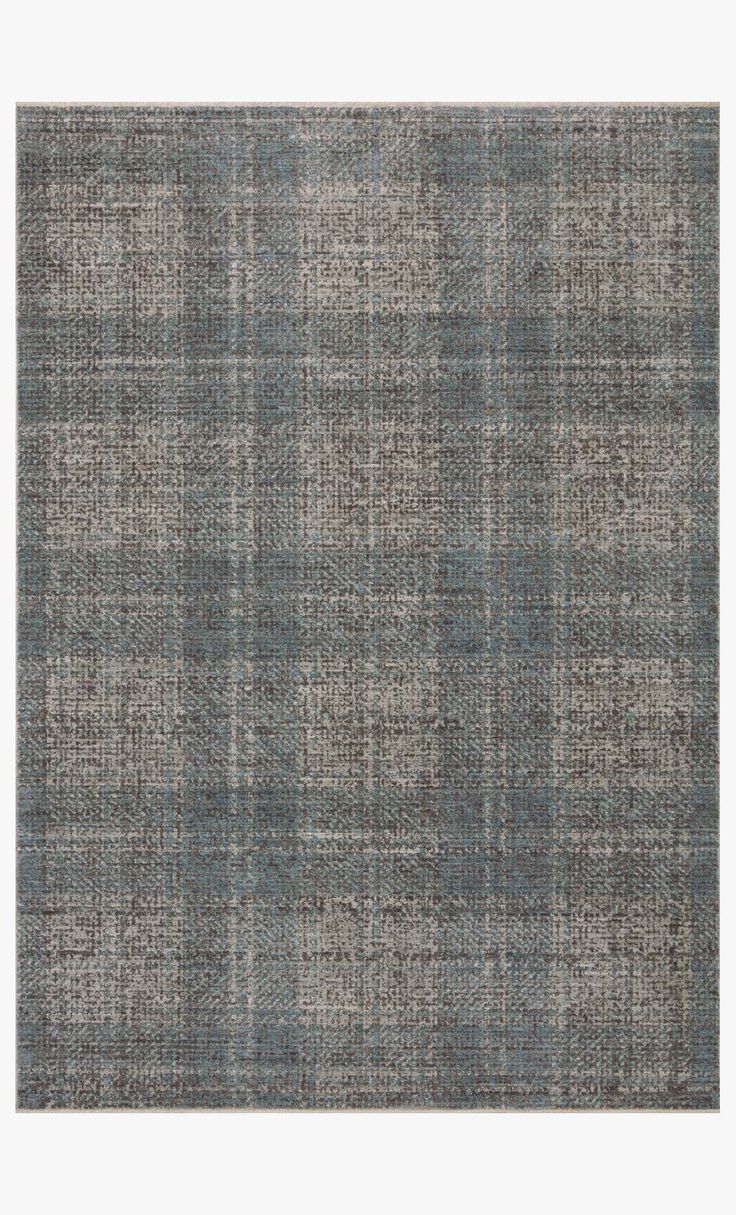 an area rug with grey and blue plaid pattern