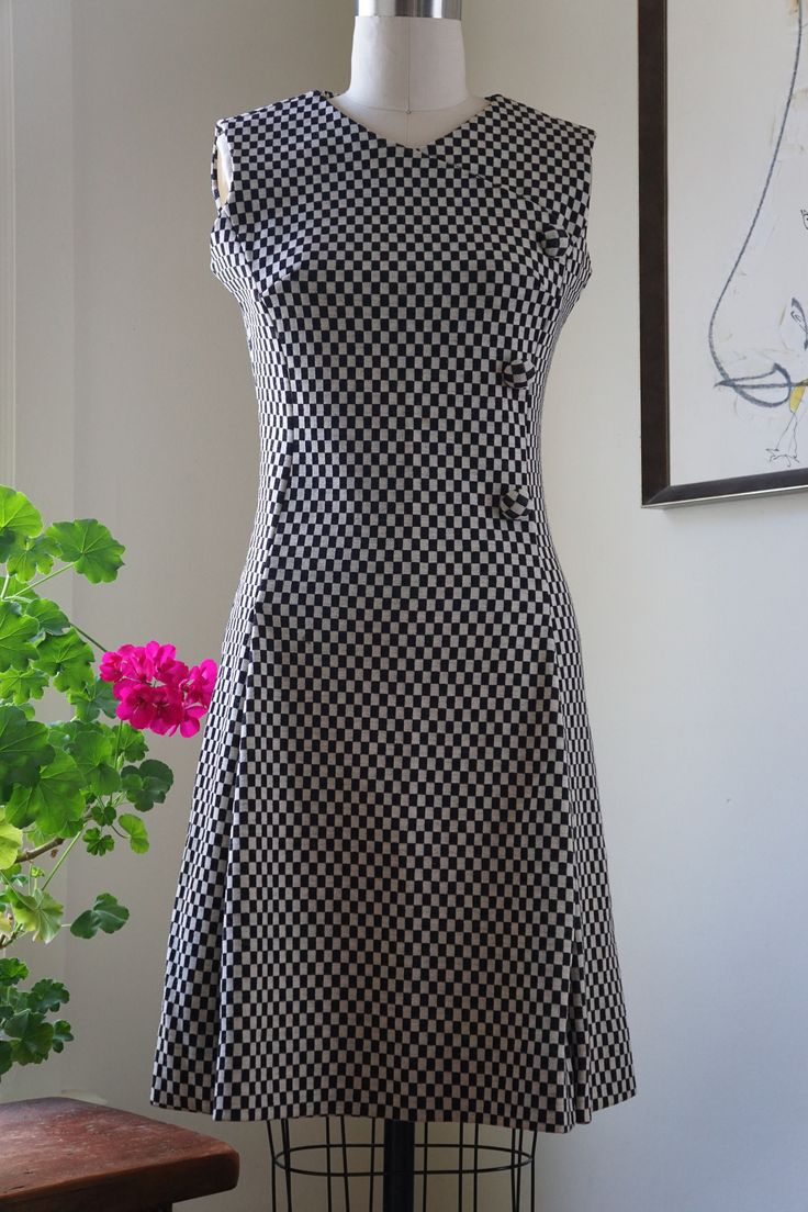 Classic A-line Wool Dress, Fitted Knee-length Wool Dress, Fitted Wool A-line Dresses, Fitted Black Wool Dress, Black Fitted Wool Dress, Black Fitted Mod Dress, Black Mod Fit Dresses, Black And White Check Dress, Sculpture Fashion