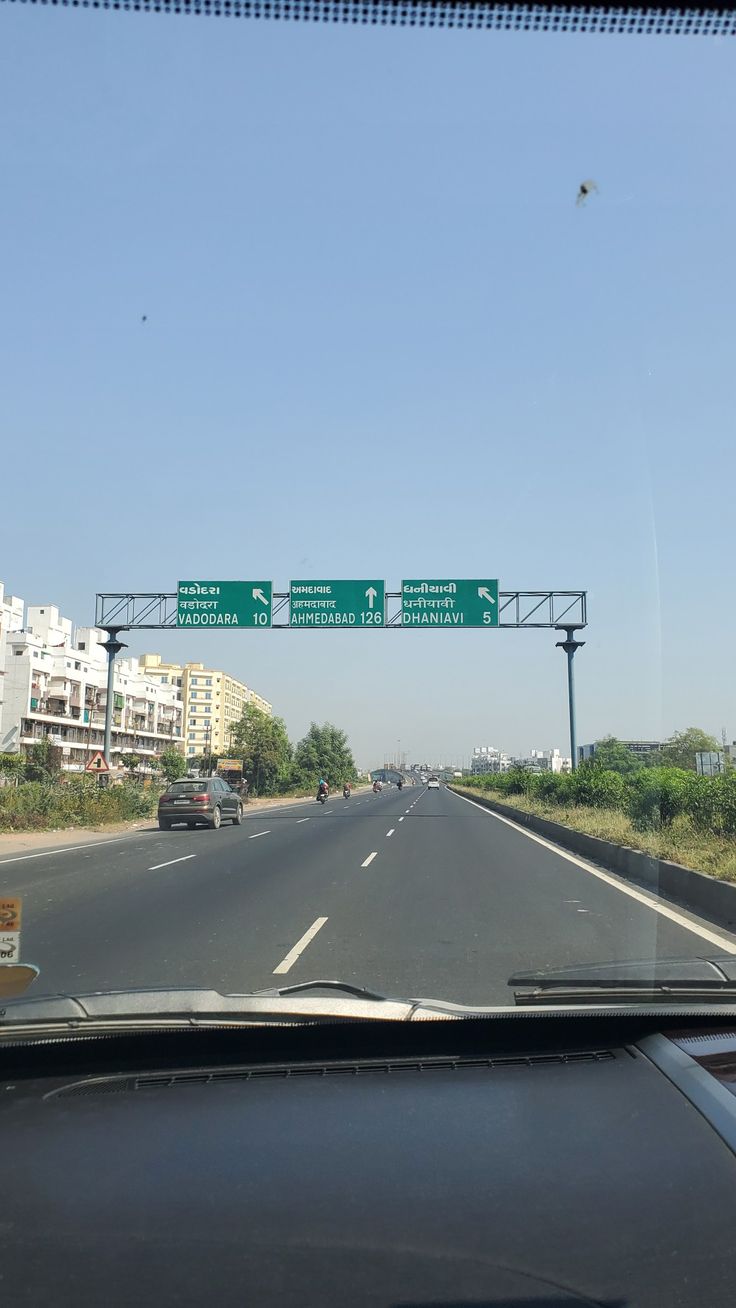 the highway sign is clearly visible for all of us to see on this stretch of road